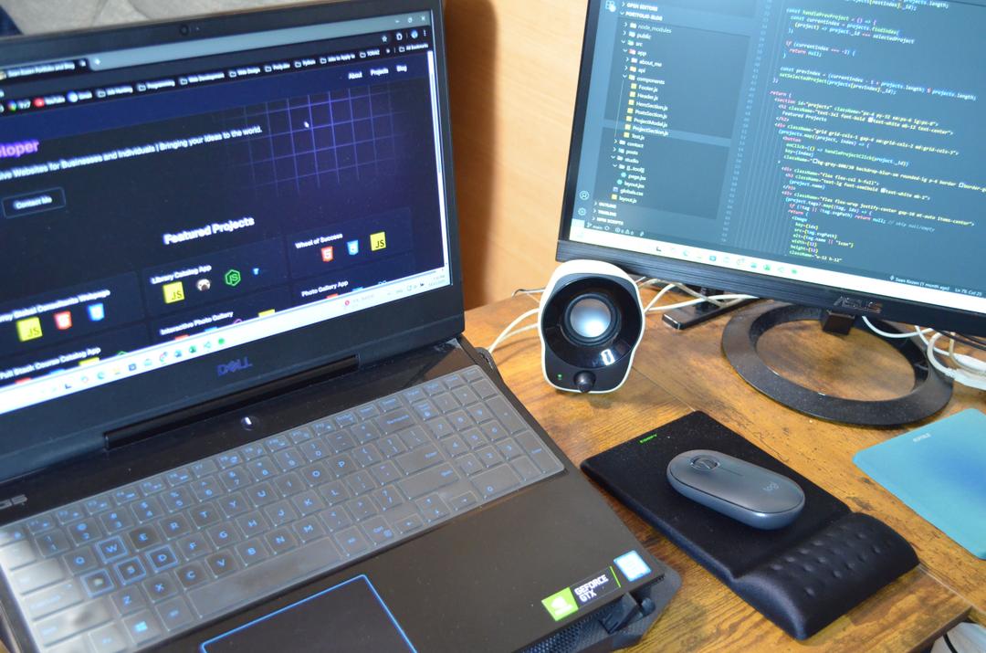 Laptop computer with desk and monitor